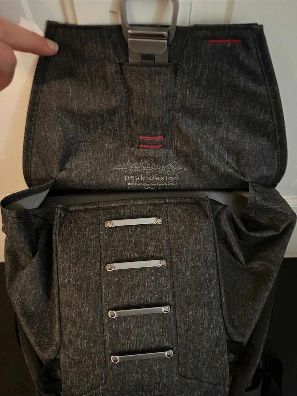 Peak Design Dark Gray Everyday Backpack with Red Accent.